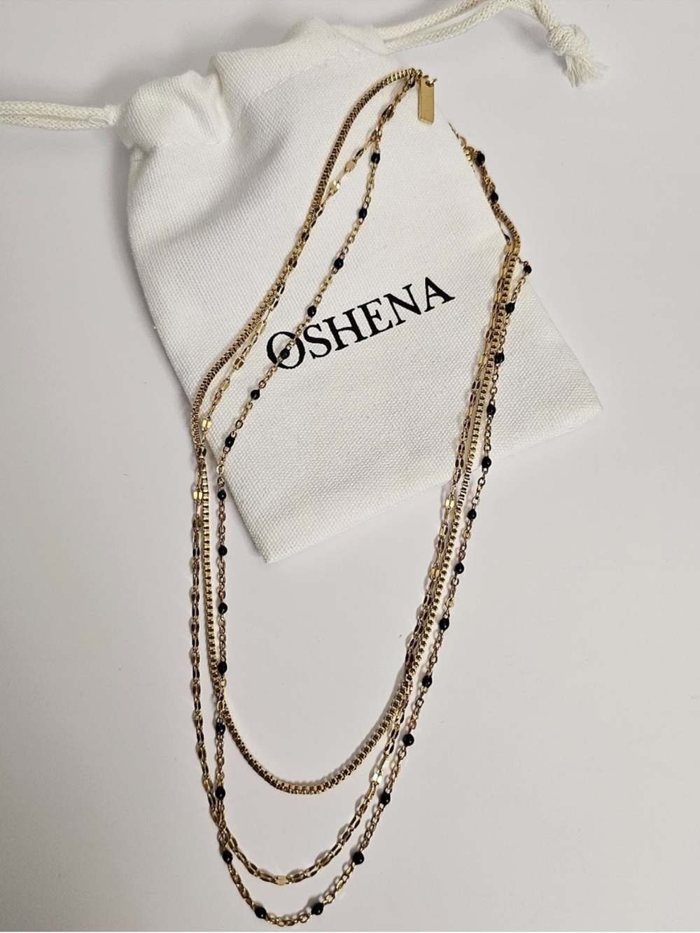 Gold Multi-Strand Necklace with Black Bead Accents